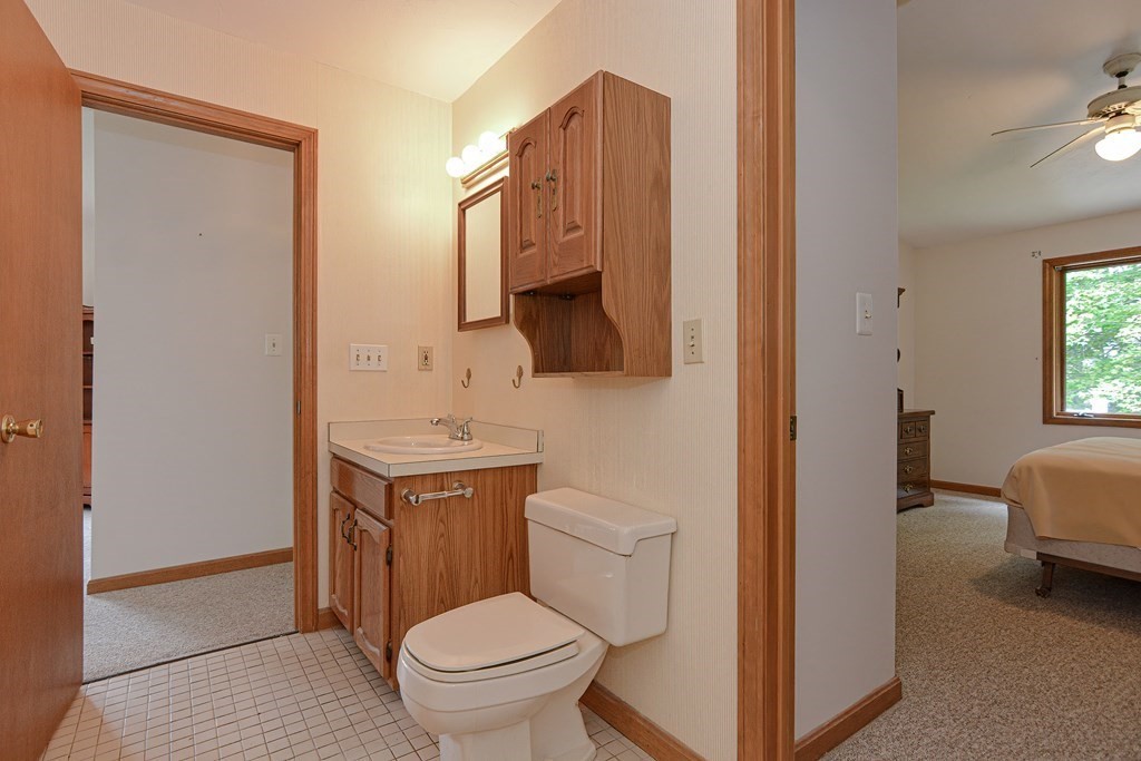 17 Nottingham Road, Unit 17 Grafton, MA 01519 - Photo 15 of 23 a bathroom with a toilet sink and mirror
