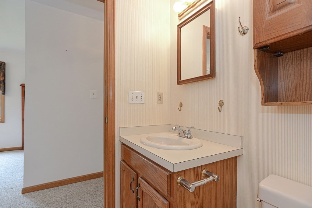 17 Nottingham Road, Unit 17 Grafton, MA 01519 - Photo 18 of 23 a bathroom with a sink and a mirror