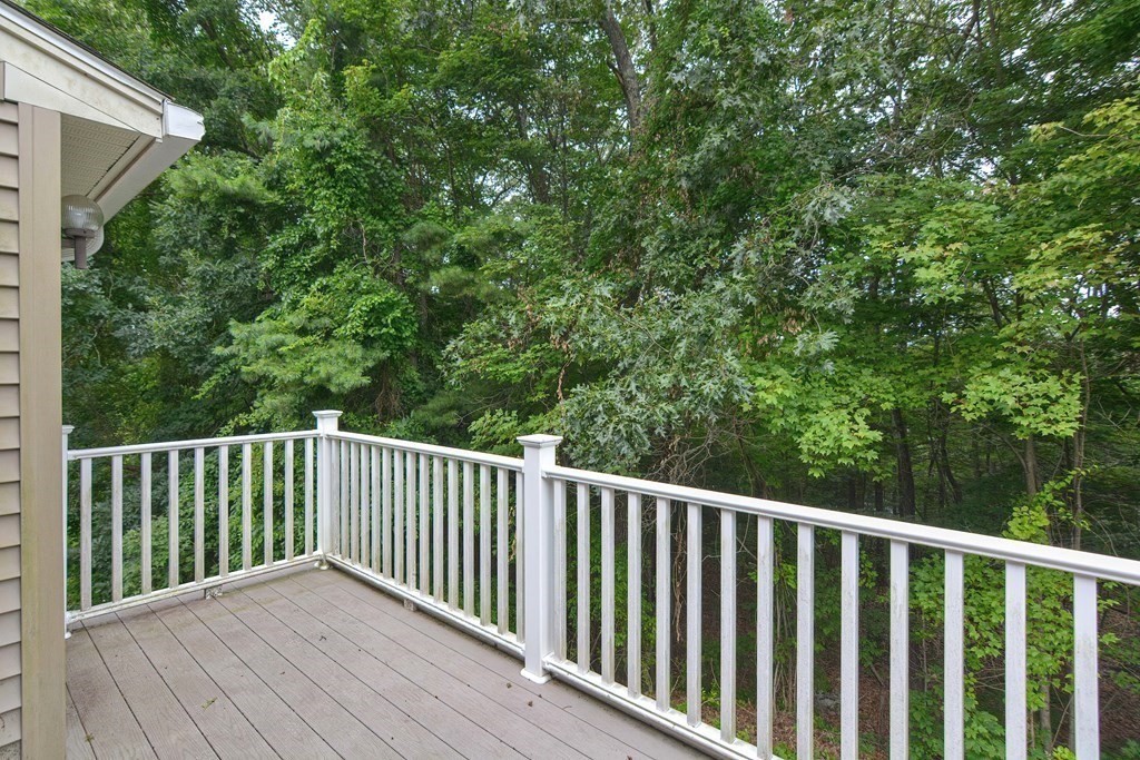 17 Nottingham Road, Unit 17 Grafton, MA 01519 - Photo 19 of 23 a balcony with wooden floor and fence
