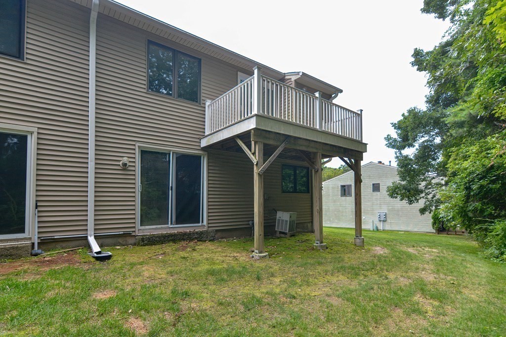 17 Nottingham Road, Unit 17 Grafton, MA 01519 - Photo 20 of 23 a view of a house with a backyard