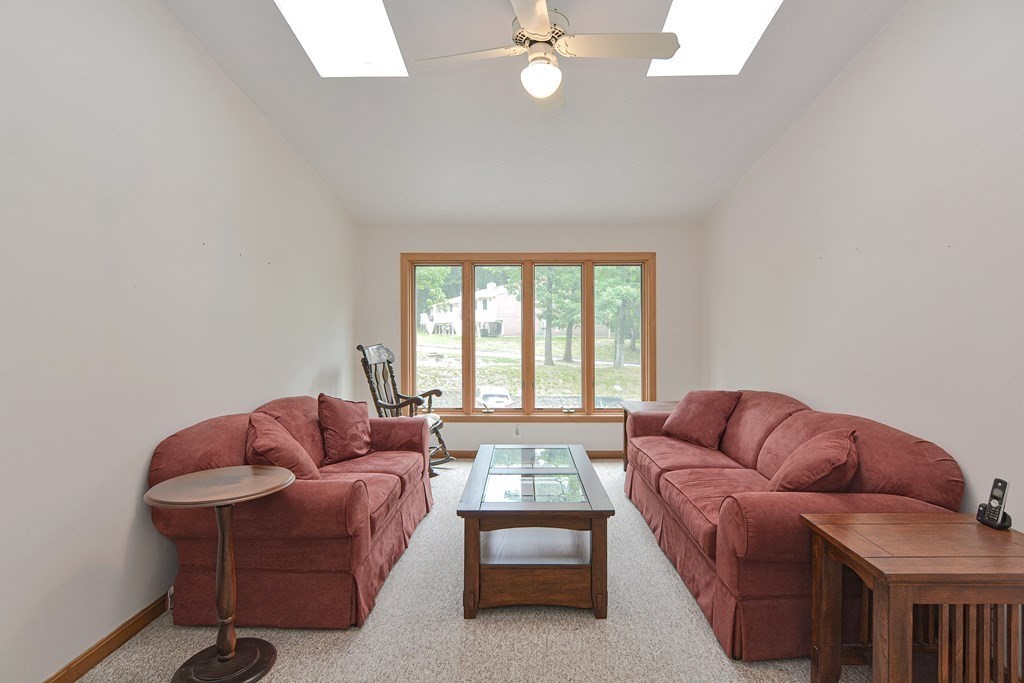 17 Nottingham Road, Unit 17 Grafton, MA 01519 - Photo 2 of 23 a living room with furniture and a window