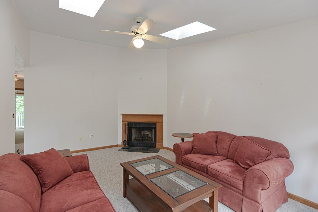 17 Nottingham Road, Unit 17 Grafton, MA 01519 - Photo 3 of 23 a living room with furniture and a fireplace