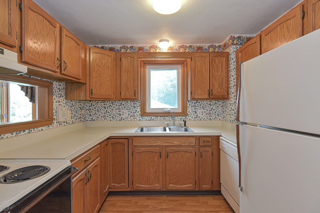 17 Nottingham Road, Unit 17 Grafton, MA 01519 - Photo 5 of 23 a kitchen with a sink stove and cabinets