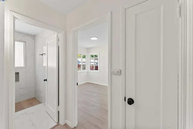 a view of a bathroom from a hallway