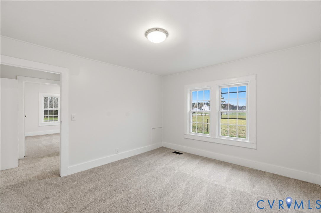 239 Brunswick Road Emporia, VA 23847 - Photo 15 of 24 Soft gray wall-to-wall carpeting, white painted wa
