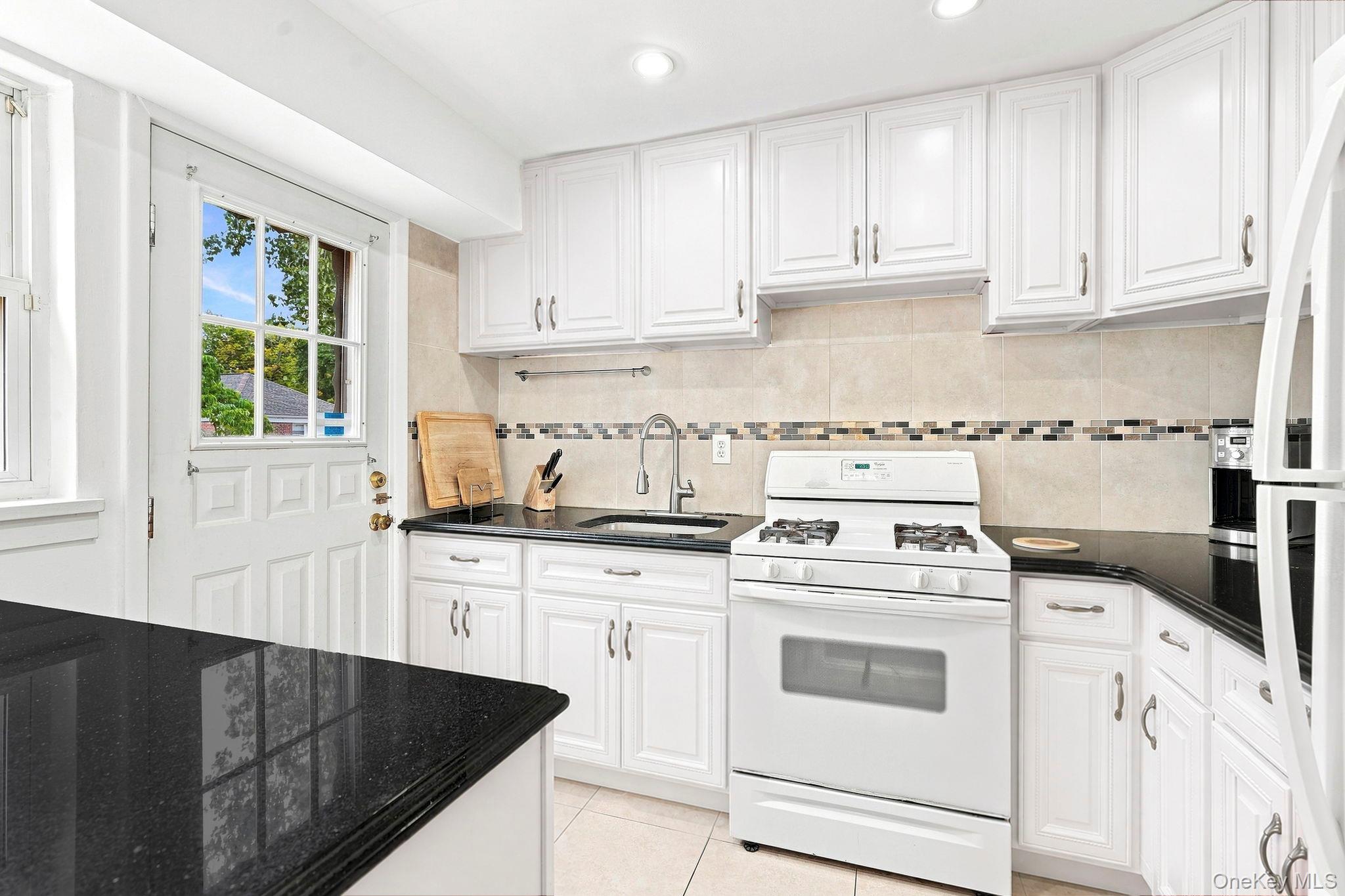 3 Peck Avenue, Unit 311A Rye, NY 10580 - Photo 11 of 24 Another view of renovated Kitchen with "to be freshy painted cabinets