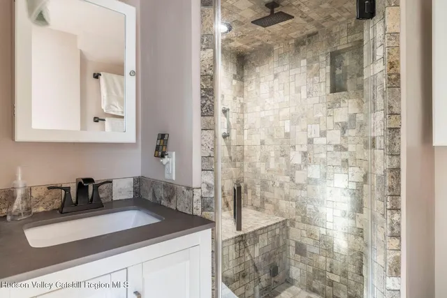 a bathroom with a sink and a mirror