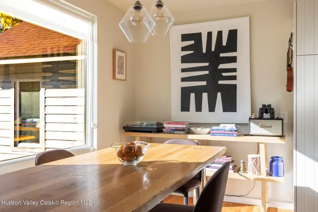 a dining room with furniture and window