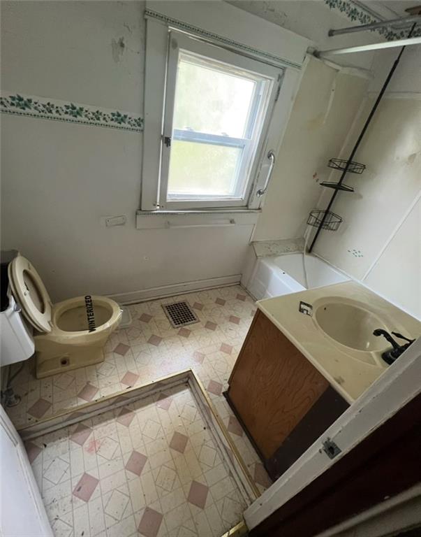 2409 25th Street Beaver Falls, PA 15010 - Photo 15 of 20 a bathroom with a granite countertop sink a toilet and bathtub