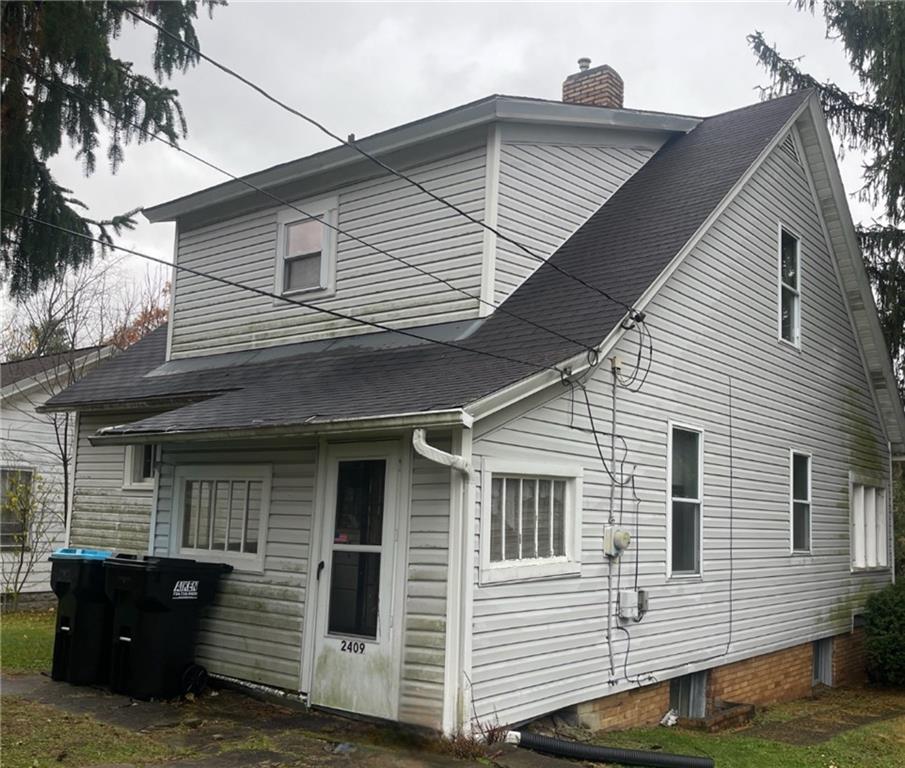 2409 25th Street Beaver Falls, PA 15010 - Photo 3 of 20 a front view of a house with garage