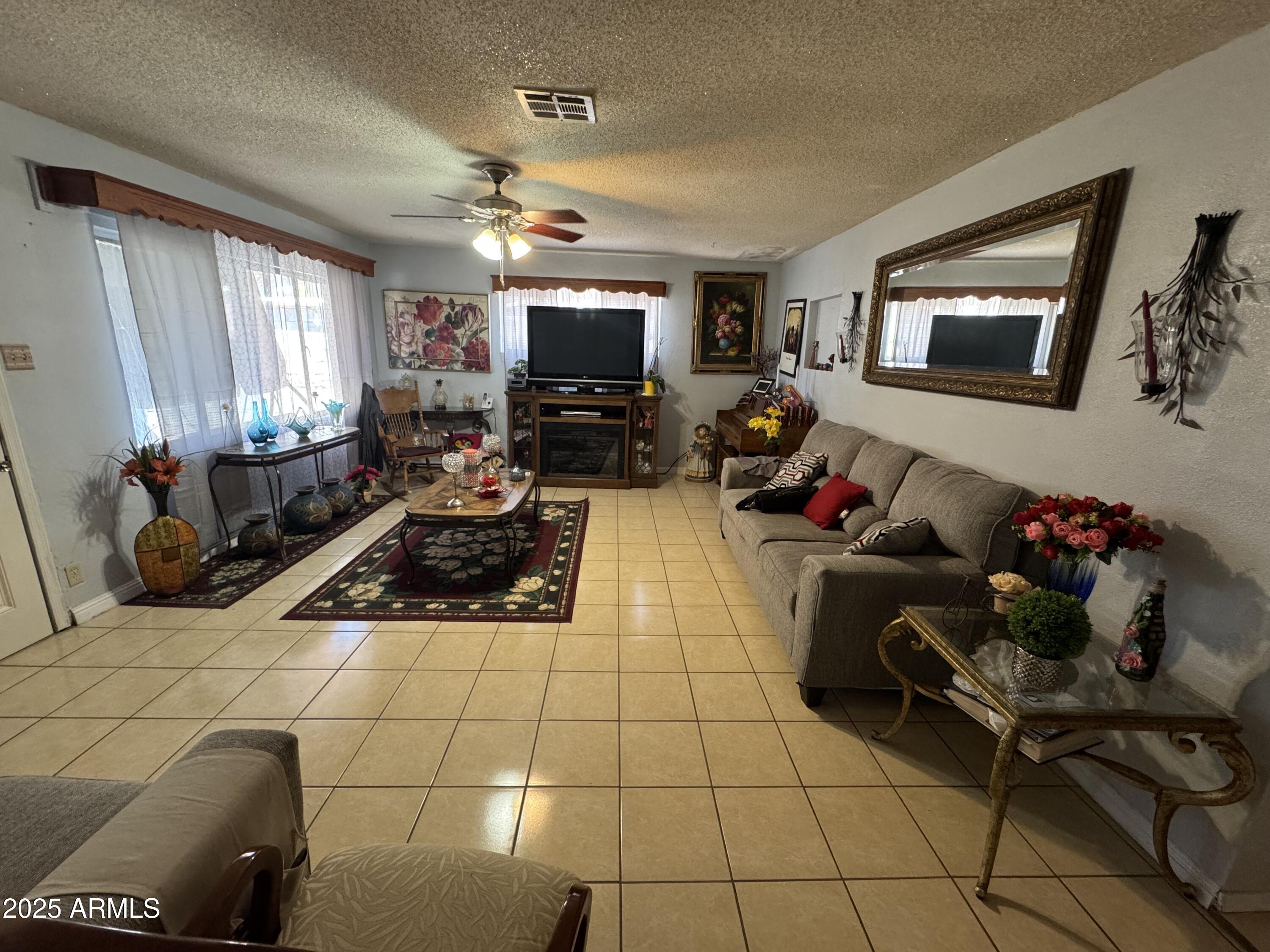 6515 North 59th Drive Glendale, AZ 85301 - Photo 20 of 47 a living room with furniture and a flat screen tv