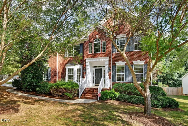 front view of a house with a garden