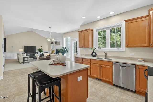 a kitchen that has a lot of cabinets in it and appliances
