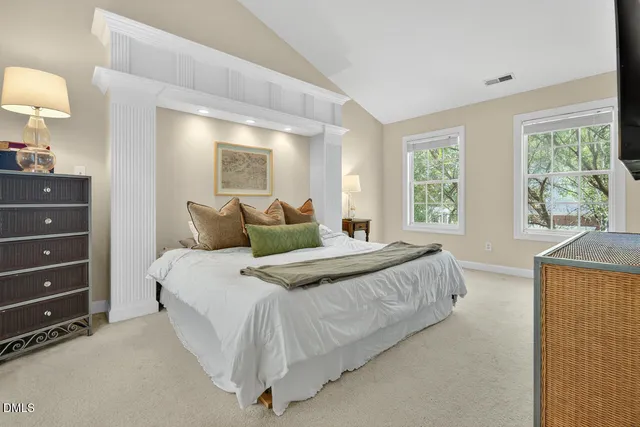 a bathroom with a sink double vanity granite tub shower and a mirror