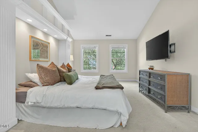 a white bath tub sitting next to a window