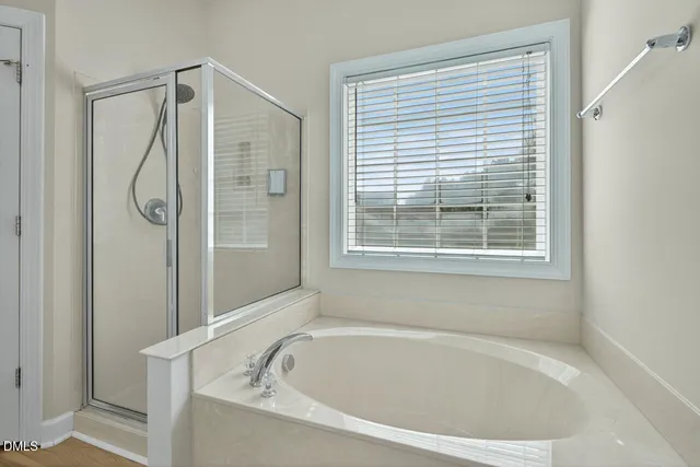 a bathroom with a sink toilet vanity and shower