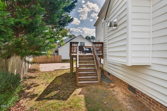 an aerial view of a house with outdoor space