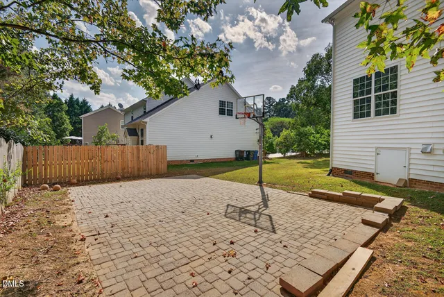 an aerial view of residential building with green space
