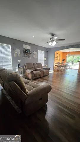 a dining room with furniture and window