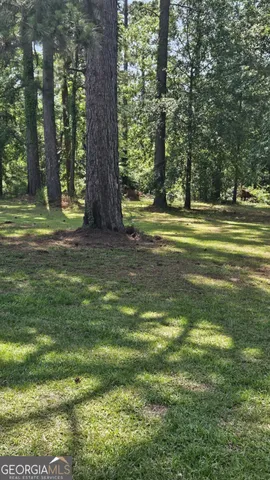 a kitchen with kitchen island a stove and a refrigerator