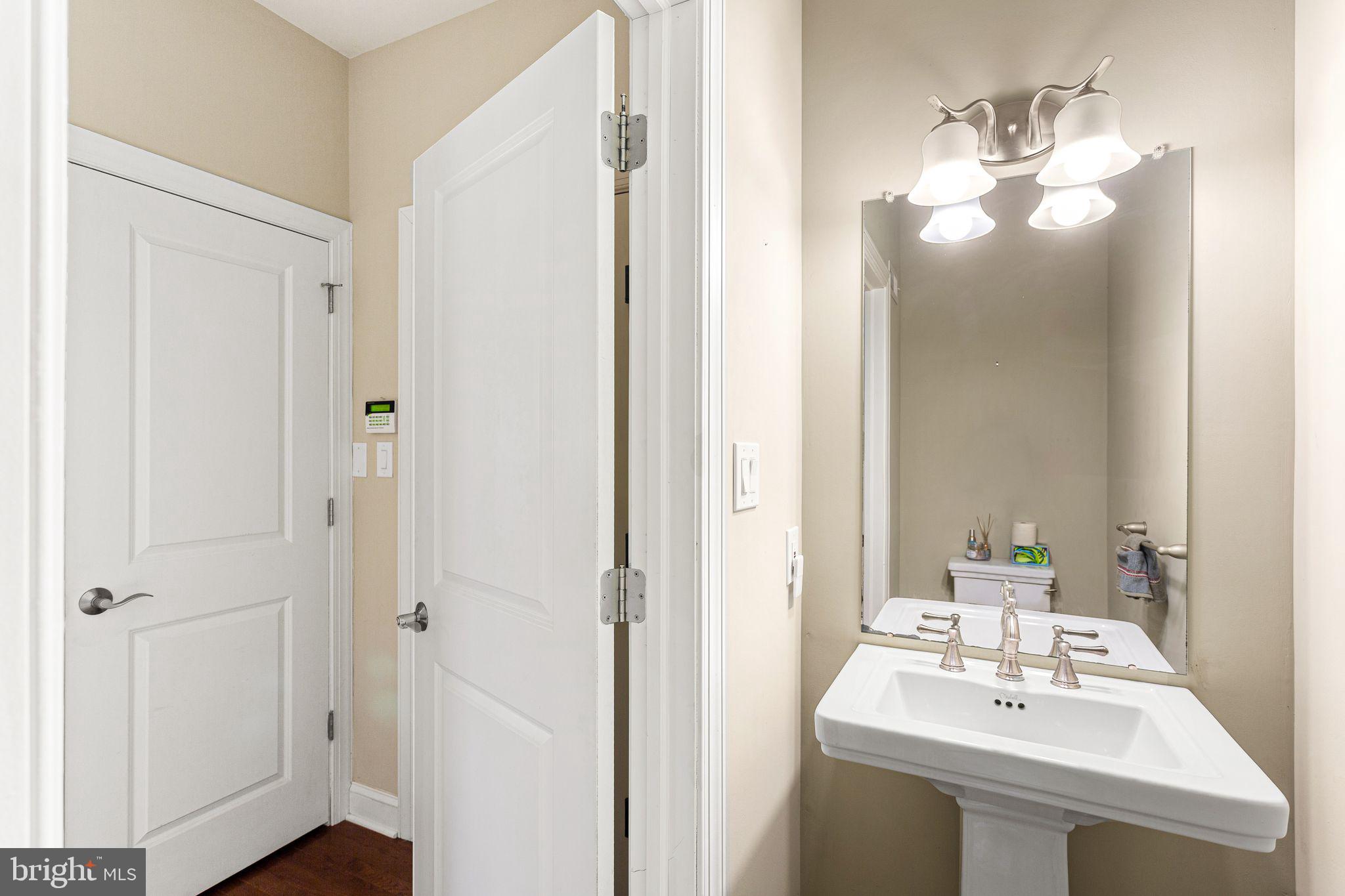 587 East Township Line Road, Unit 1 Blue Bell, PA 19422 - Photo 13 of 33 Elegant half-bath with modern fixtures.