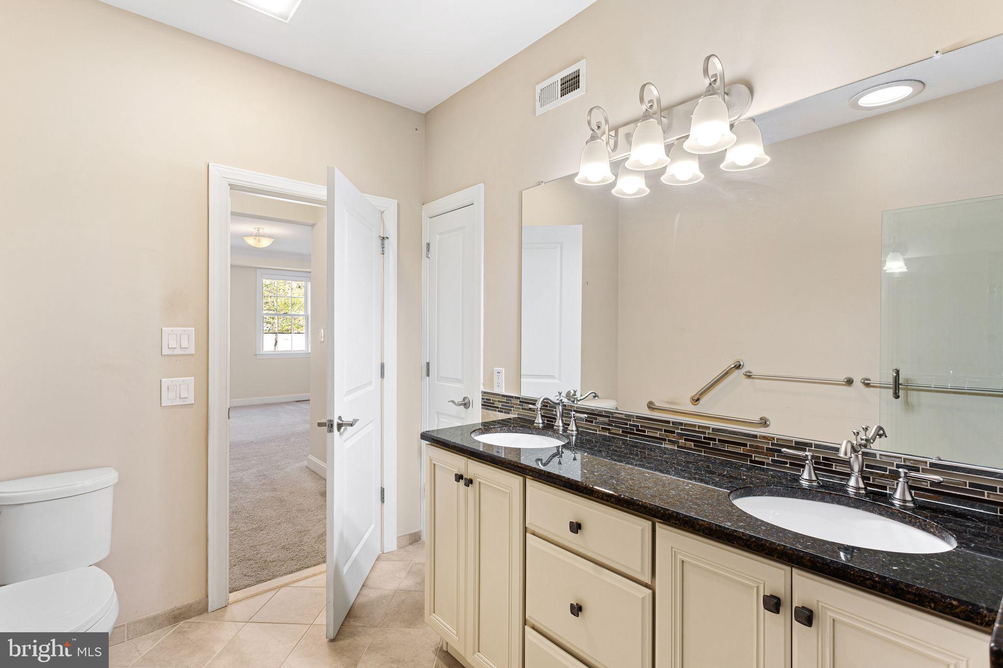 587 East Township Line Road, Unit 1 Blue Bell, PA 19422 - Photo 19 of 33 Elegant dual-sink bathroom retreat.