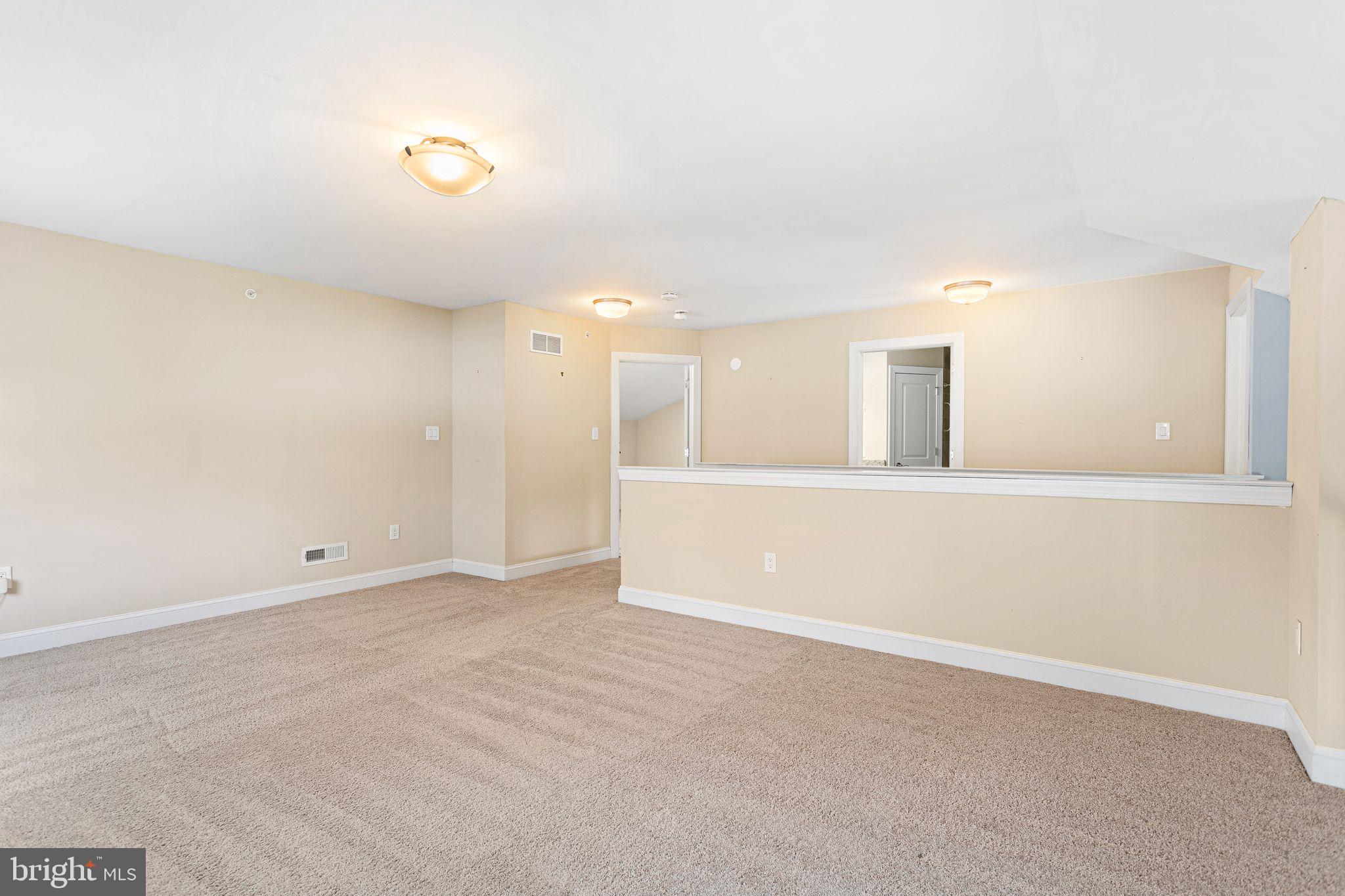 587 East Township Line Road, Unit 1 Blue Bell, PA 19422 - Photo 22 of 33 Spacious, sunlit living area awaits you.