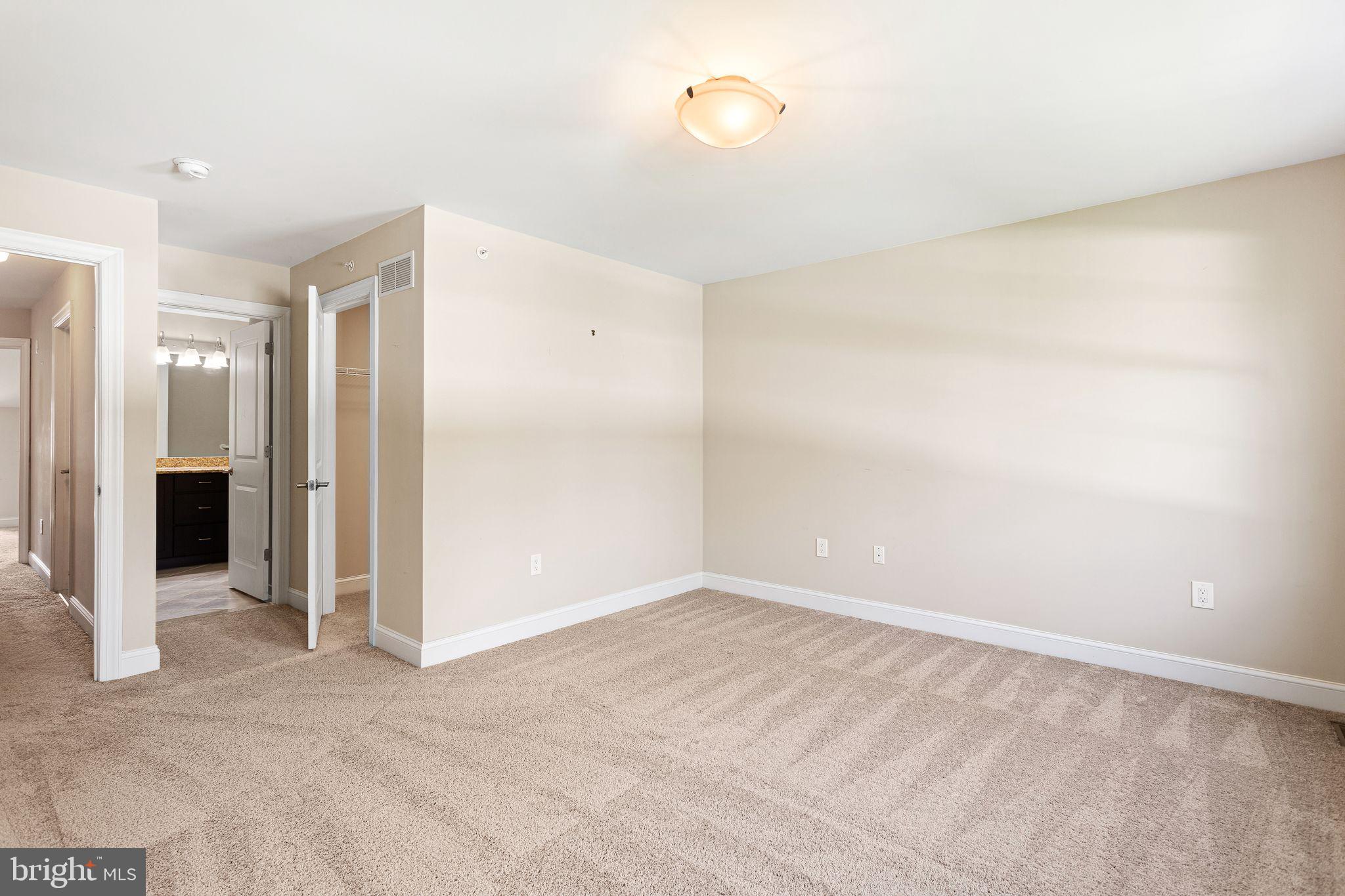 587 East Township Line Road, Unit 1 Blue Bell, PA 19422 - Photo 24 of 33 Spacious, sunlit room awaits your touch.