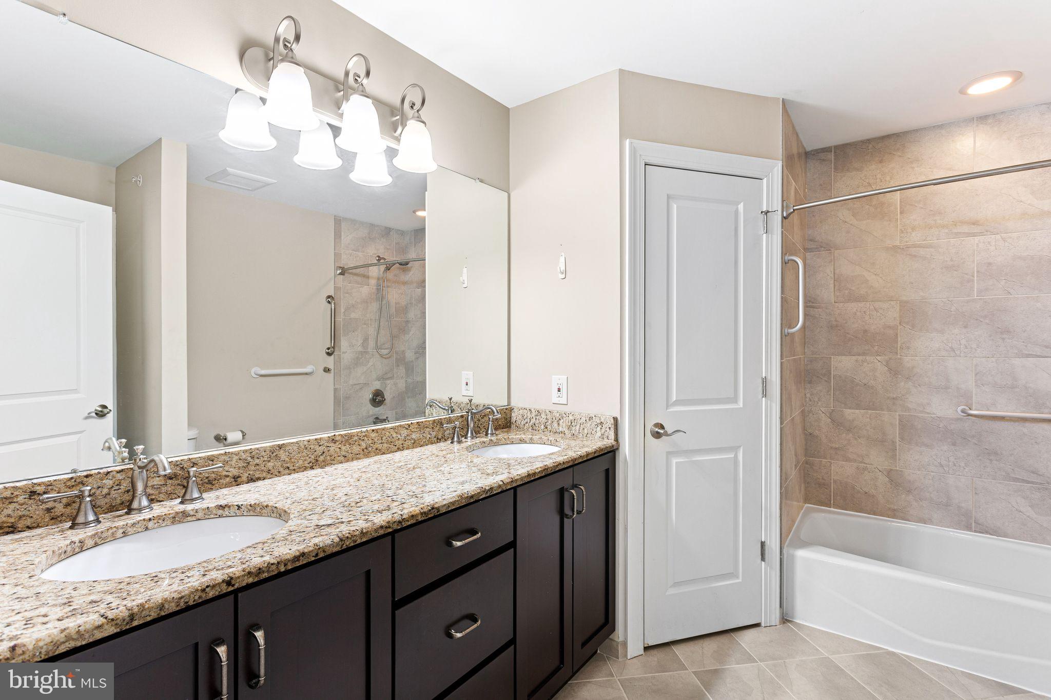 587 East Township Line Road, Unit 1 Blue Bell, PA 19422 - Photo 29 of 33 Elegant dual-sink bathroom retreat.