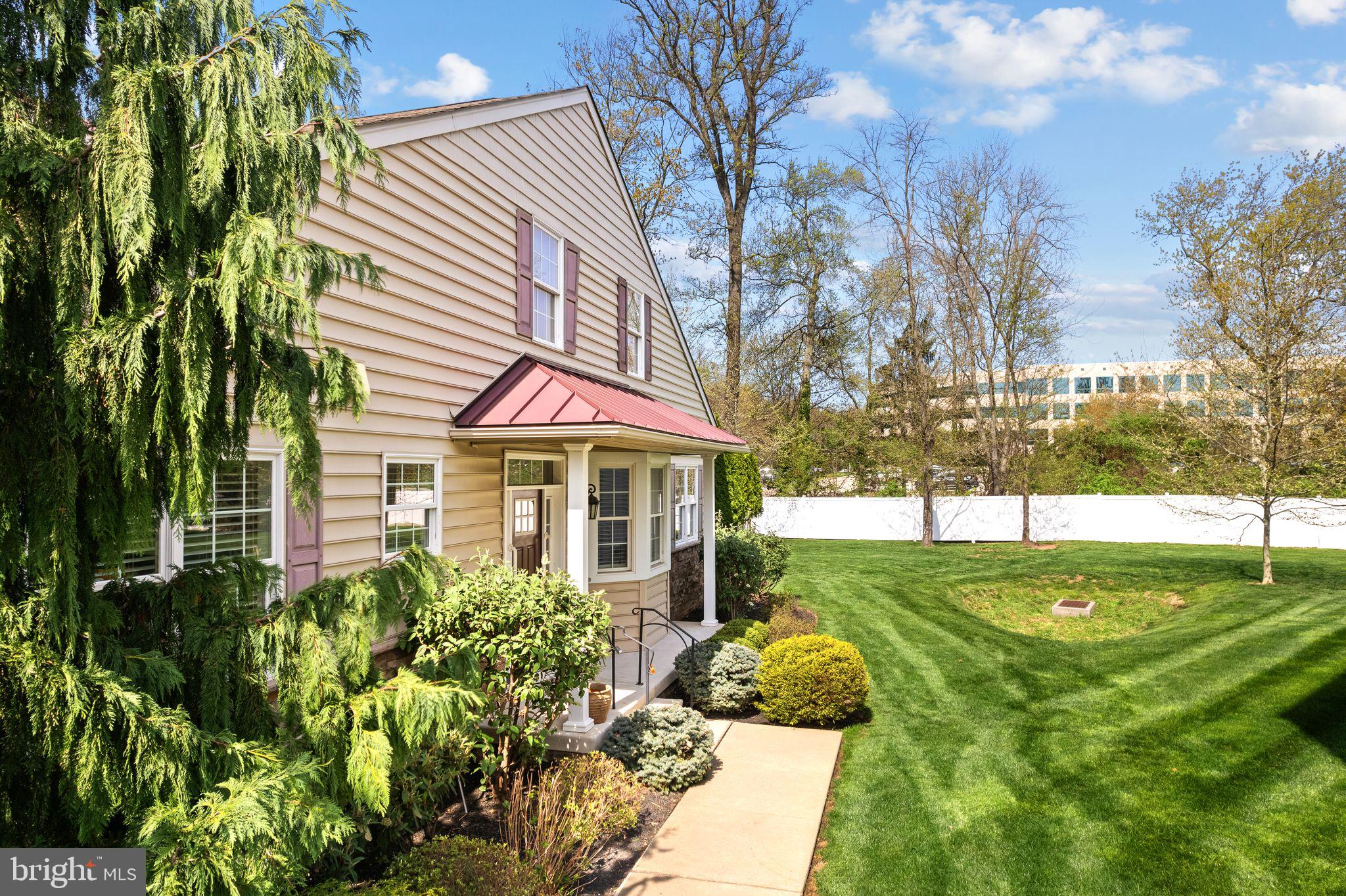 587 East Township Line Road, Unit 1 Blue Bell, PA 19422 - Photo 31 of 33 Charming home with lush green yard.