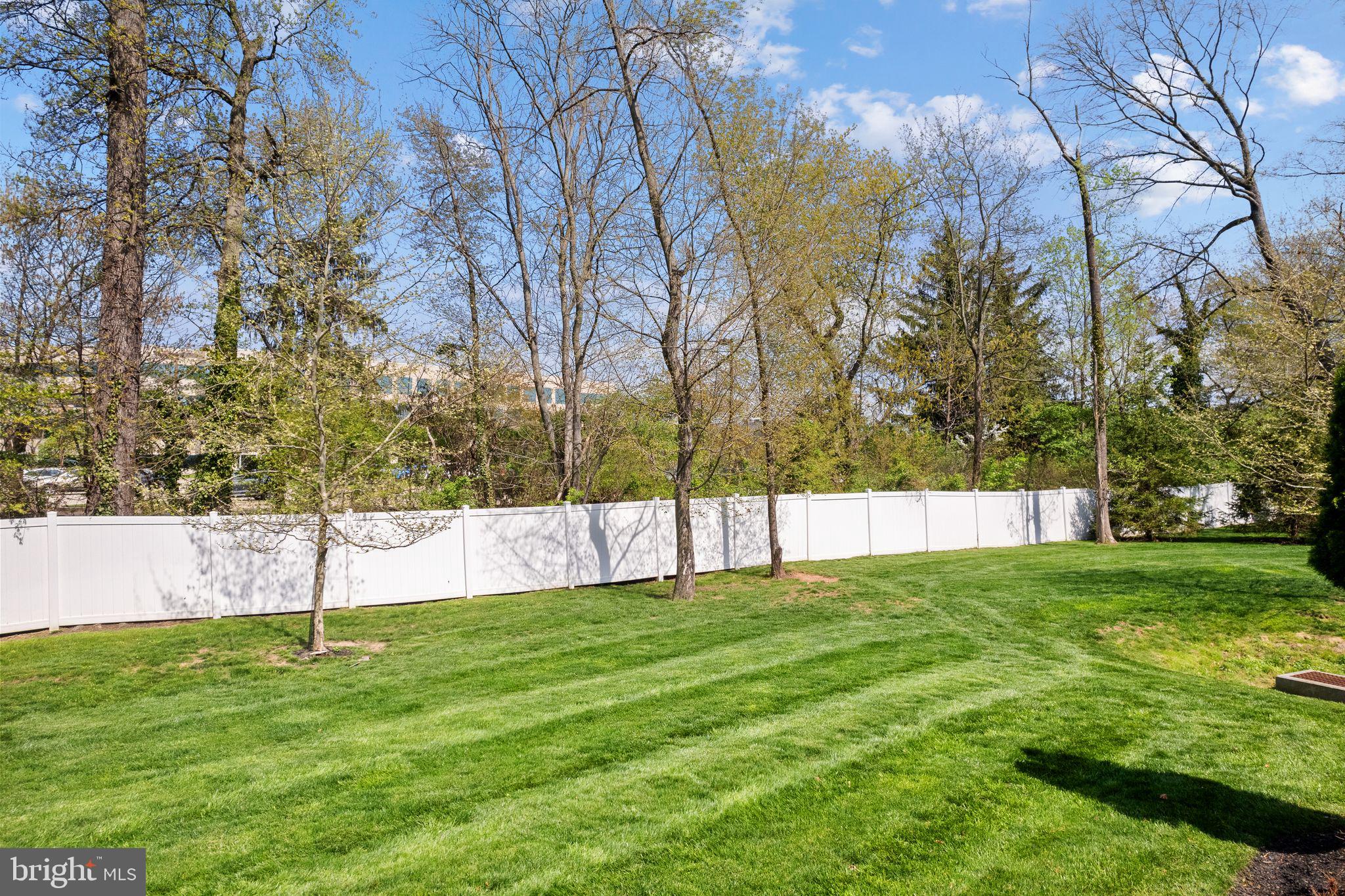 587 East Township Line Road, Unit 1 Blue Bell, PA 19422 - Photo 33 of 33 Lush green lawn under a clear sky.