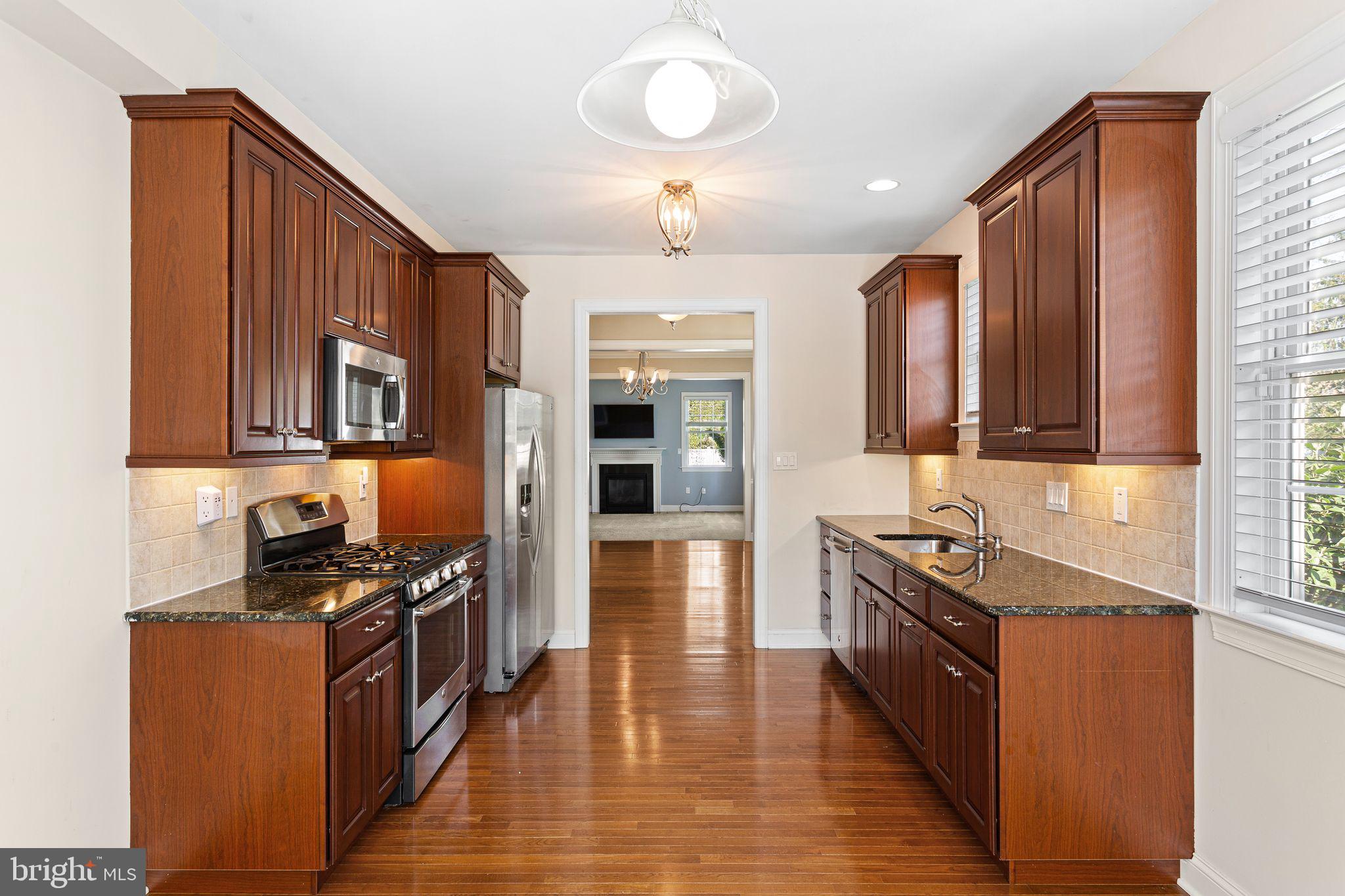 587 East Township Line Road, Unit 1 Blue Bell, PA 19422 - Photo 4 of 33 Modern kitchen with rich wood accents.