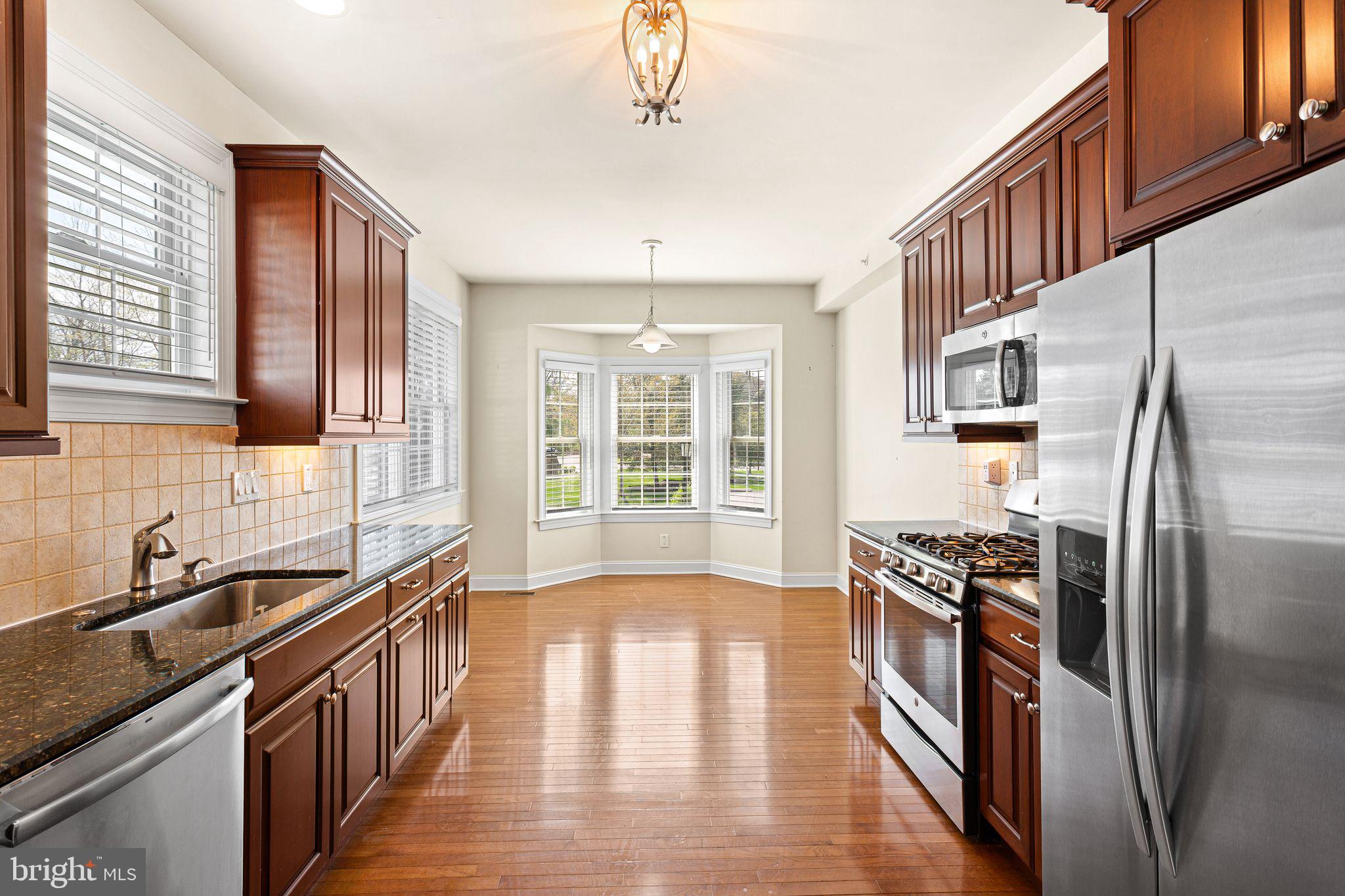 587 East Township Line Road, Unit 1 Blue Bell, PA 19422 - Photo 5 of 33 Elegant kitchen with natural light.