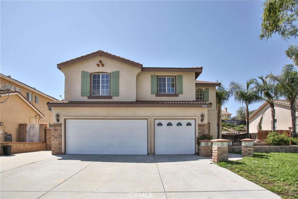8937 Coyote Bush Road Riverside, CA 92508 - Photo 1 of 1 a front view of a house with garage