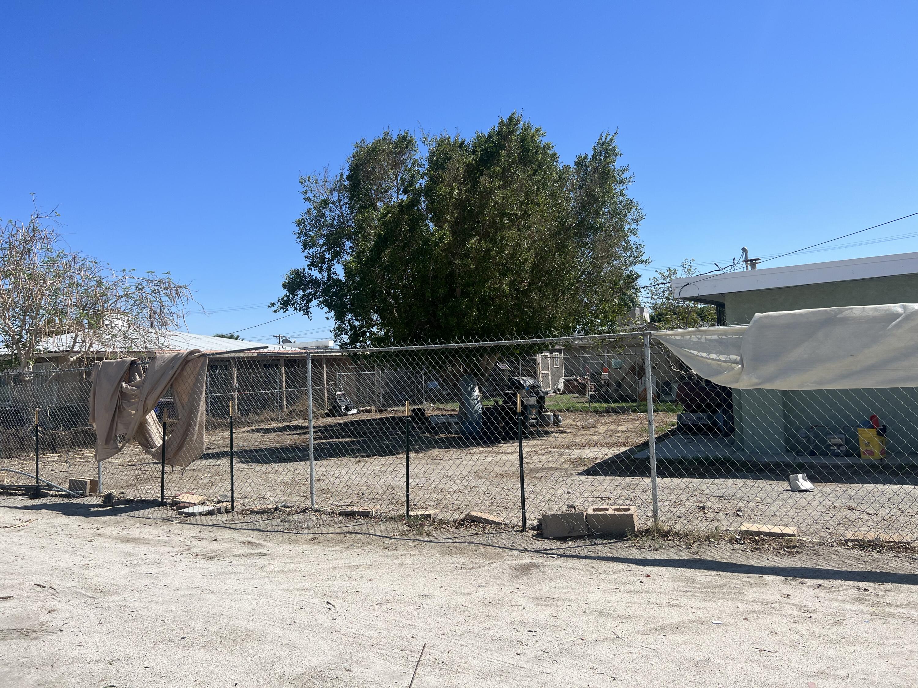 47902 Luzon Street Indio, CA 92201 - Photo 2 of 11 a front view of a house with a yard