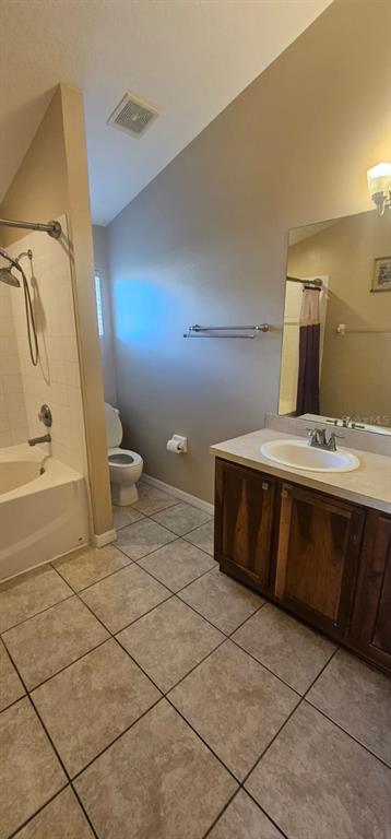 8504 Shallow Creek Court New Port Richey, FL 34653 - Photo 27 of 28 a bathroom with a sink a toilet and mirror