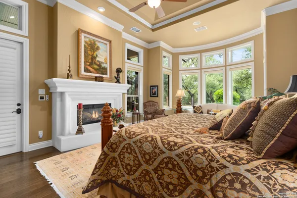 a living room with patio furniture and a chandelier