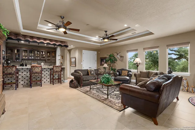 a outdoor living space with furniture and a fireplace