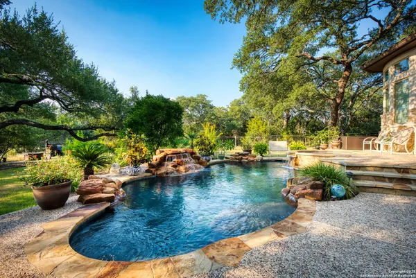 a view of a swimming pool with a patio