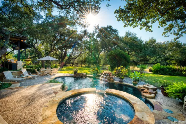 a view of a swimming pool with a patio