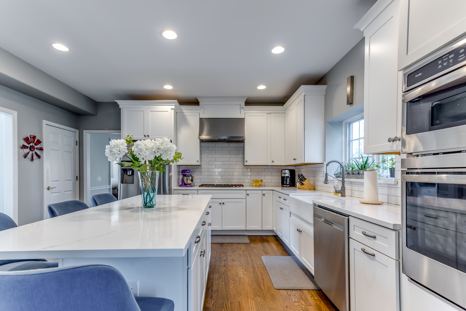 3819 Grassmere Road Naperville, IL 60564 - Photo 8 of 38 a large kitchen with granite countertop a large counter top a sink stainless steel appliances and cabinets