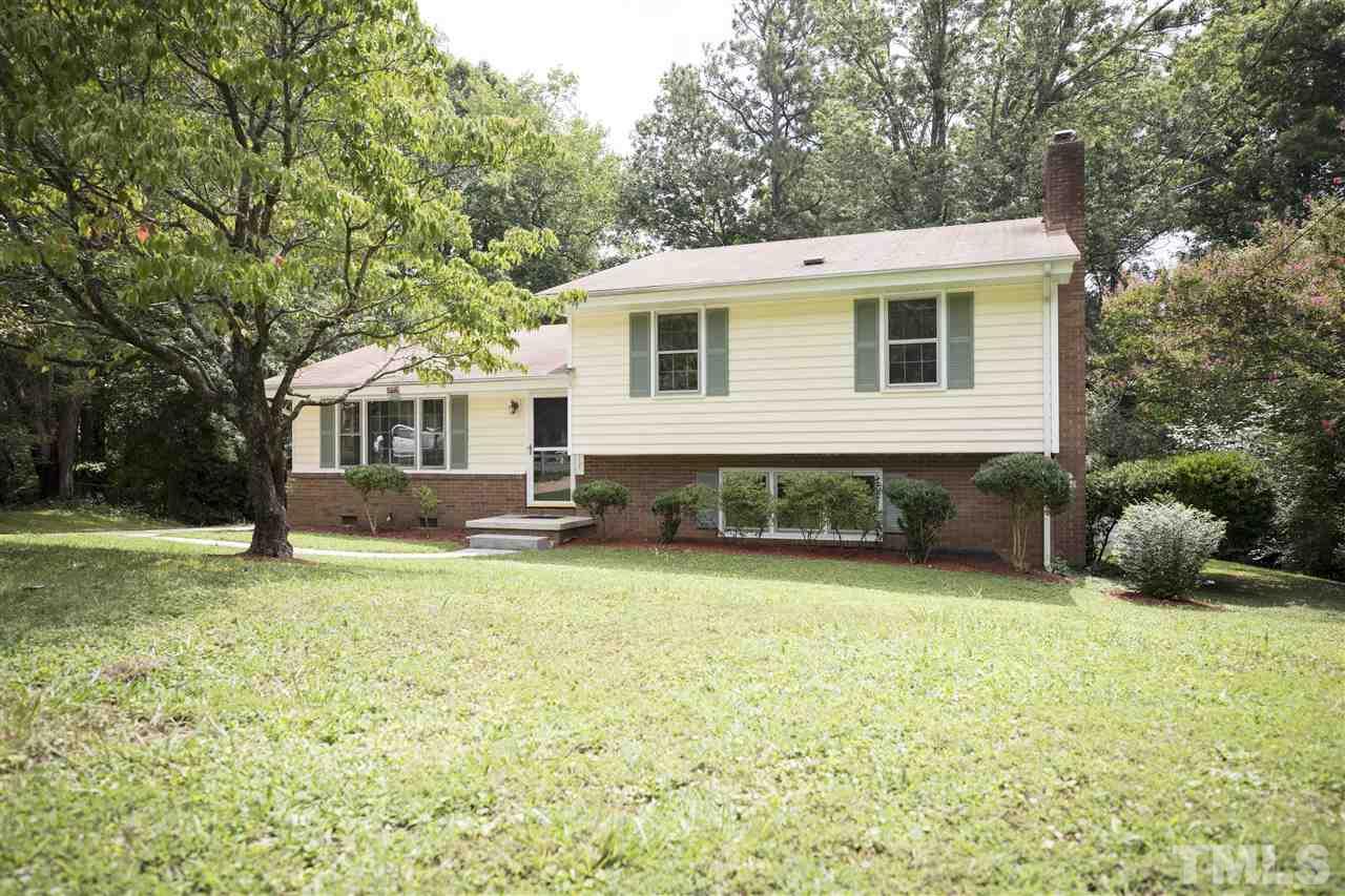 2708 Ramsey Road Raleigh, NC 27604 - Photo 1 of 21 a front view of a house with a garden and trees