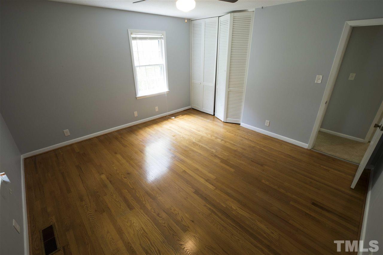 2708 Ramsey Road Raleigh, NC 27604 - Photo 14 of 21 an empty room with wooden floor and windows