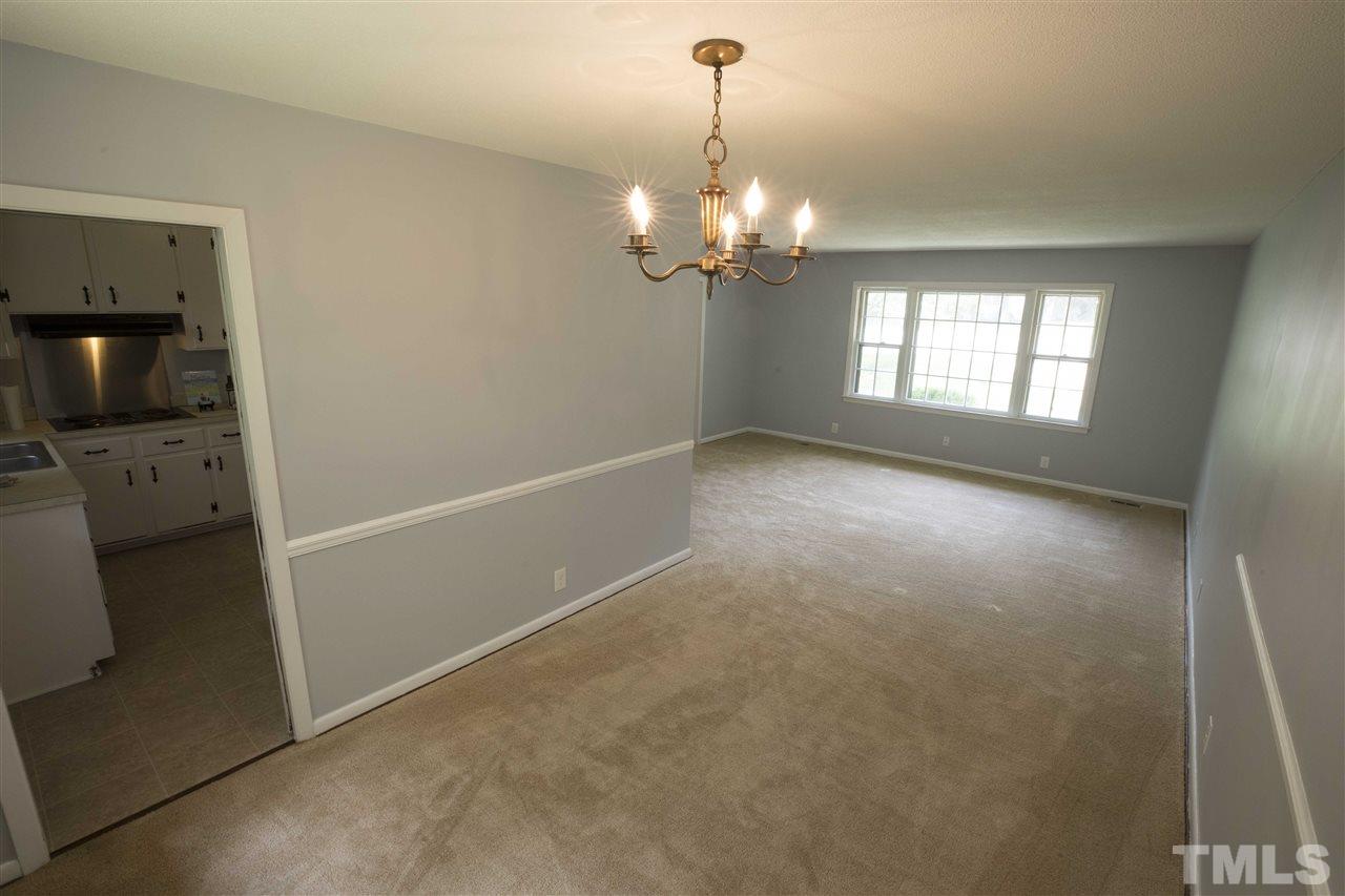 2708 Ramsey Road Raleigh, NC 27604 - Photo 7 of 21 a view of a livingroom with a chandelier