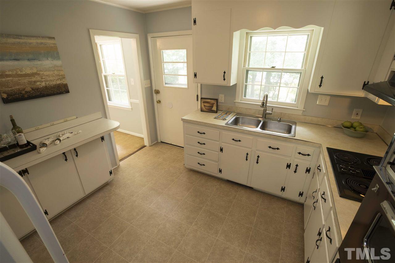 2708 Ramsey Road Raleigh, NC 27604 - Photo 8 of 21 a spacious bathroom with a double vanity sink window and a mirror