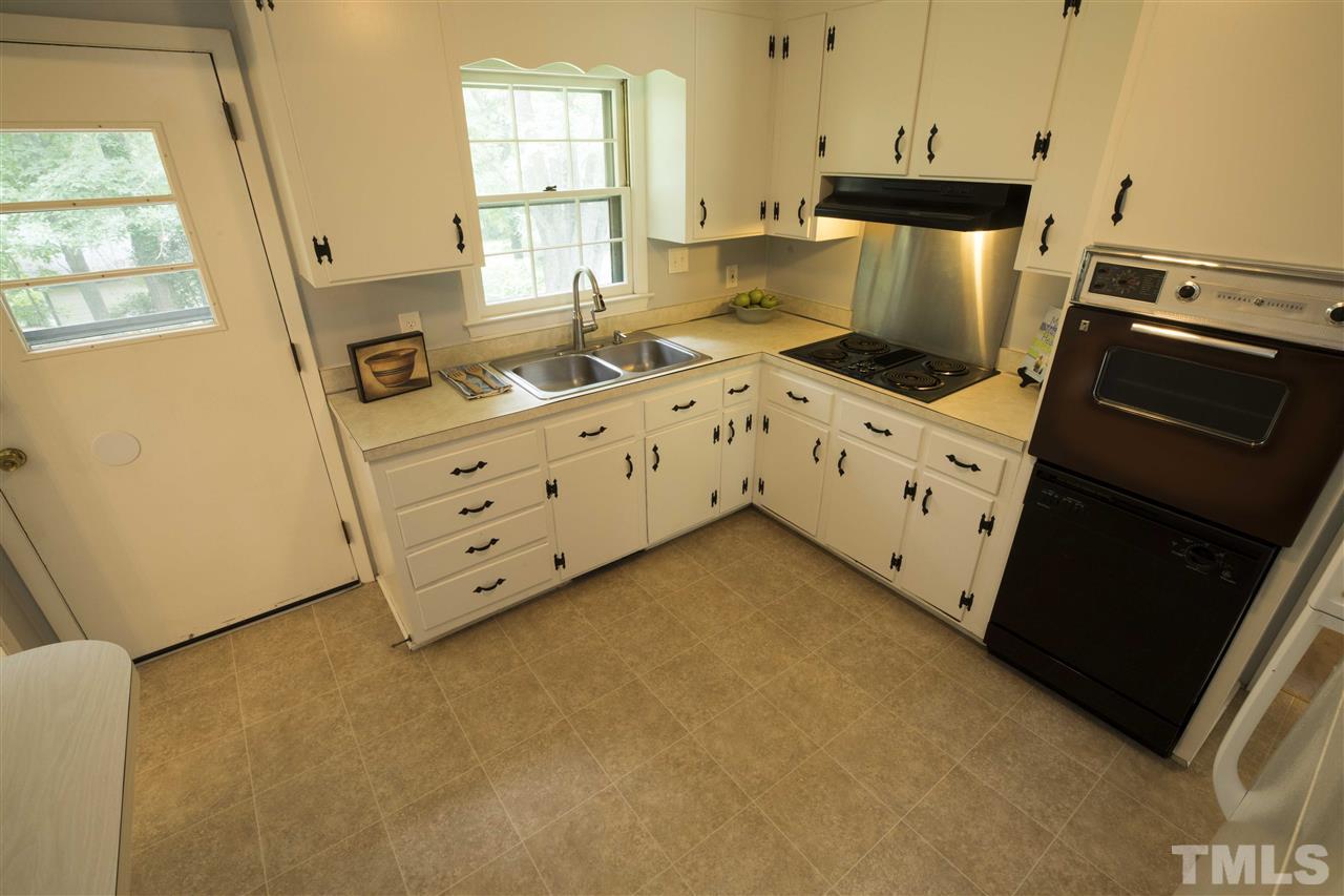 2708 Ramsey Road Raleigh, NC 27604 - Photo 10 of 21 a kitchen with cabinets appliances and a window
