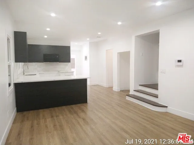 a spacious bathroom with a large mirror