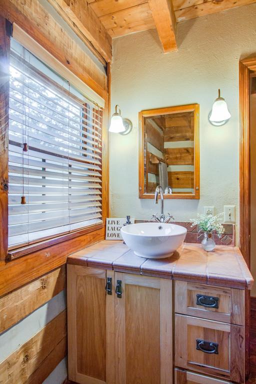 5534 Vanderbilt Road Old Hickory, TN 37138 - Photo 16 of 27 a bathroom with a sink and a mirror