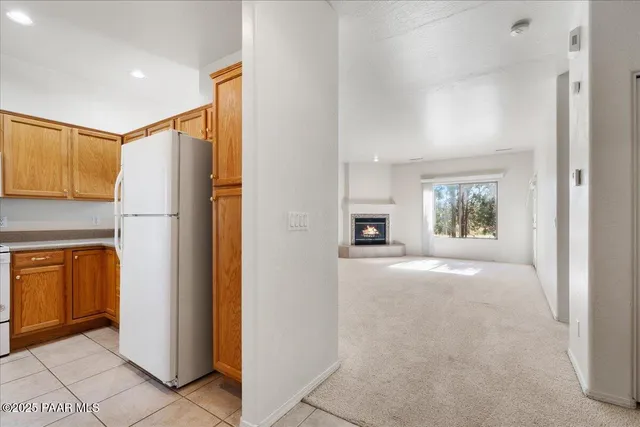 a kitchen with a sink cabinets and window