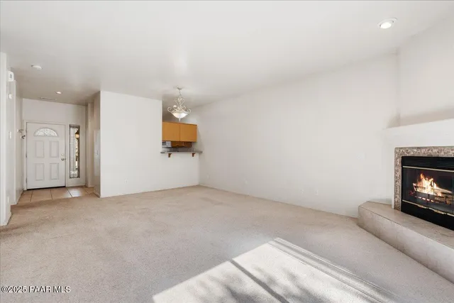 en empty room with projector and fan